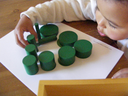 Working with Montessori Knobless Cylinders (Photo from Homeschool Escapade)