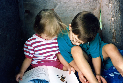 Our homeschool had lots of reading, sometimes even in a treehouse. Christina (2) and Will (7), 1992.