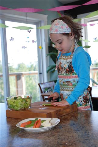 Montessori Food Preparation - Making a Salad with Food She Picked from the Garden (Photo from The Montessori Child at Home)