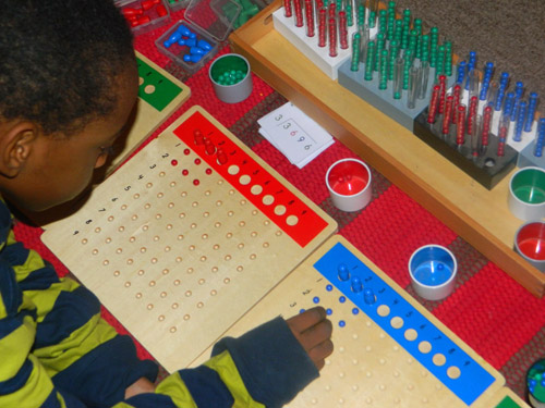 Montessori Long Division Boards with Racks and Tubes (Photo from We Don't Need No Education)